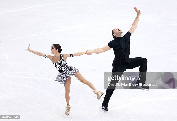 Vera Bazarova and Yuri Larionov of Russia compete during the Figure Skating Pairs Short Program on day four of the Sochi 2014 Winter Olympics at...