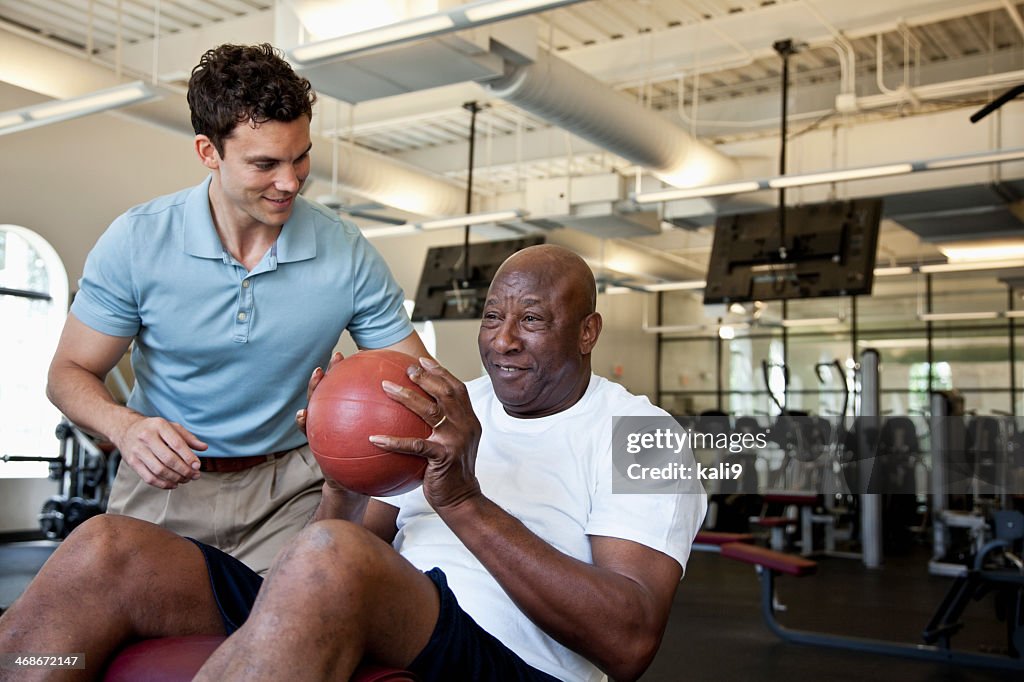 Man working out with fitness ball