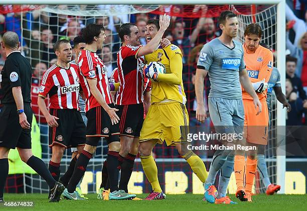 Billy Jones, John O'Shea and Costel Pantilimon of Sunderland celebrate victory at the final whistle during the Barclays Premier League match between...