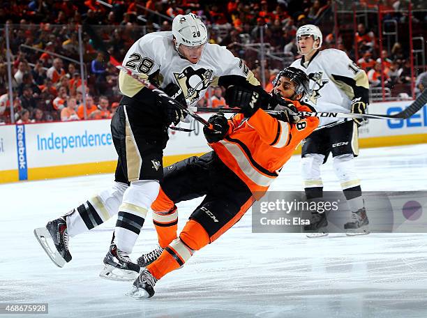 Ian Cole of the Pittsburgh Penguins checks Pierre-Edouard Bellemare of the Philadelphia Flyers in the second period on April 5, 2015 at the Wells...