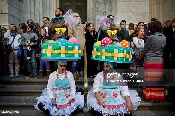 Attendees gather in front of St. Patricks Cathedral along Fifth Avenue during the annual Easter Parade April 5, 2015 in New York City. The parade...