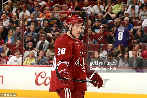 Michael Stone of the Arizona Coyotes gets ready during a faceoff against the Buffalo Sabres at Gila River Arena on March 30, 2015 in Glendale,...