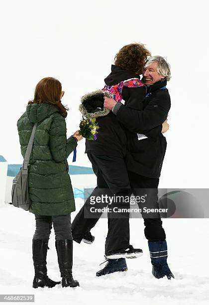 Iouri Podladtchikov of Switzerland celebrates with family after the Snowboard Men's Halfpipe Finals on day four of the Sochi 2014 Winter Olympics at...