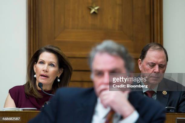 Representative Michele Bachmann, a Republican of Minnesota, left, questions Federal Reserve Chairman Janet Yellen, unseen, during Yellen's...