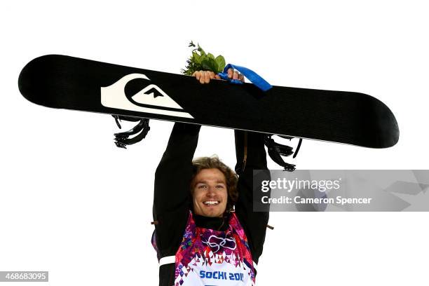 Gold medalist Iouri Podladtchikov of Switzerland celebrates on the podium during the flower ceremony for the Snowboard Men's Halfpipe Finals on day...