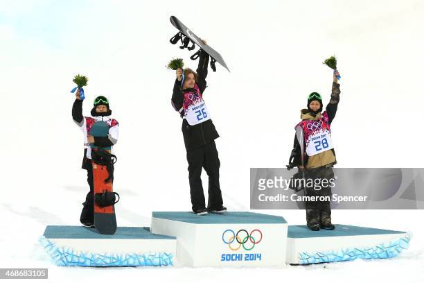 Silver medalist Ayumu Hirano of Japan, gold medalist Iouri Podladtchikov of Switzerland and bronze medalist Taku Hiraoka of Japan celebrate on the...