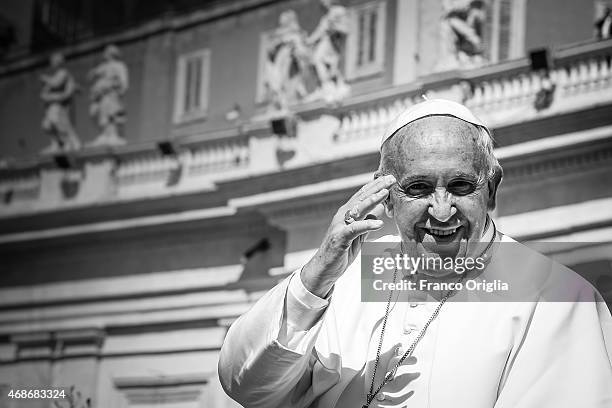 Pope Francis waves to the faithful as he leaves St. Peter's Square at the the end of Palm Sunday Mass on March 29, 2015 in Vatican City, Vatican....