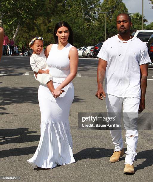 Kim Kardashian, Kanye West and North West are seen at church for Easter in Los Angeles on April 05, 2015 in Los Angeles, California.