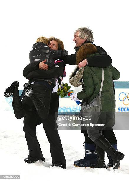 Iouri Podladtchikov of Switzerland celebrates with family after the Snowboard Men's Halfpipe Finals on day four of the Sochi 2014 Winter Olympics at...