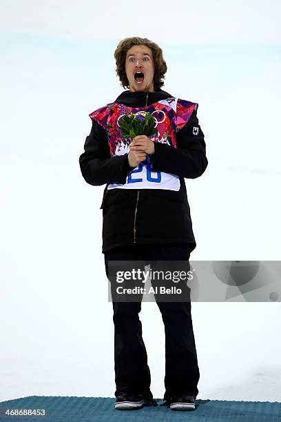 Gold medalist Iouri Podladtchikov of Switzerland celebrates on the podium during the flower ceremony for the Snowboard Men's Halfpipe Finals on day...