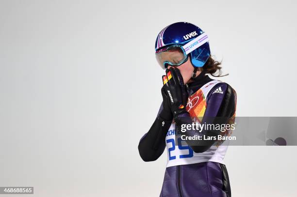 Carina Vogt of Germany reacts after jumping during the Ladies' Normal Hill Individual final round on day 4 of the Sochi 2014 Winter Olympics at the...