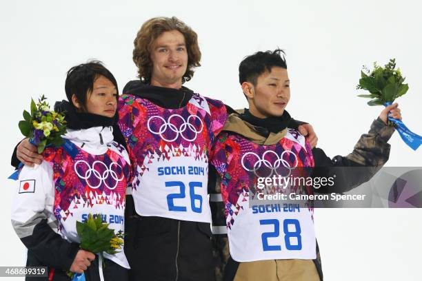 Silver medalist Ayumu Hirano of Japan, gold medalist Iouri Podladtchikov of Switzerland and bronze medalist Taku Hiraoka of Japan celebrate on the...