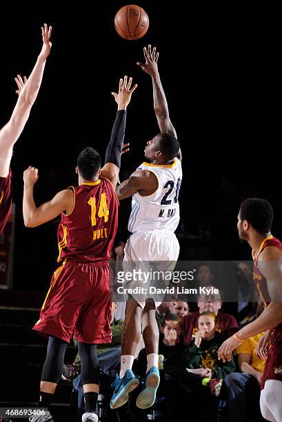 Marcus Hall of the Iowa Energy shoots over Stephen Holt of the Canton Charge at the Canton Memorial Civic Center on April 3, 2015 in Canton, Ohio....