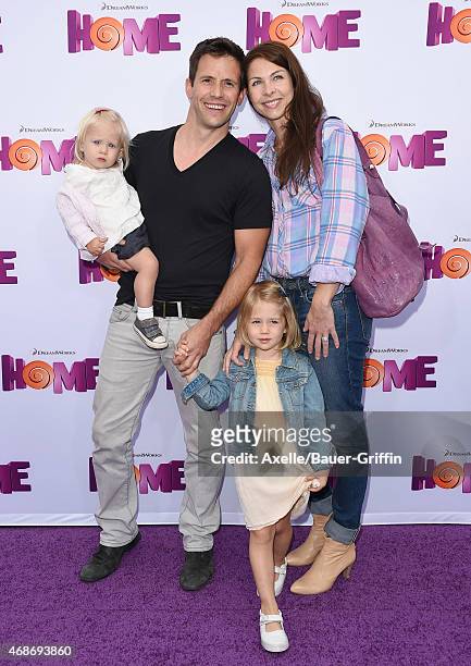 Actor Christian Oliver, wife Jessica Mazur and their children arrive at the Los Angeles premiere of 'HOME' at Regency Village Theatre on March 22,...