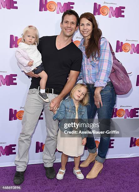 Actor Christian Oliver, wife Jessica Mazur and their children arrive at the Los Angeles premiere of 'HOME' at Regency Village Theatre on March 22,...