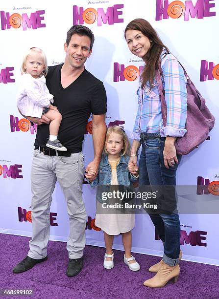 Actor Christian Oliver and his family arrive at Twentieth Century Fox And Dreamworks Animation's 'Home' Premiere at Regency Village Theatre on March...