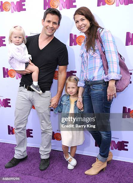 Actor Christian Oliver and his family arrive at Twentieth Century Fox And Dreamworks Animation's 'Home' Premiere at Regency Village Theatre on March...