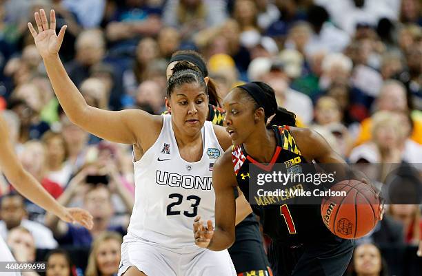 Laurin Mincy of the Maryland Terrapins drives against Kaleena Mosqueda-Lewis of the Connecticut Huskies in the first half during the NCAA Women's...