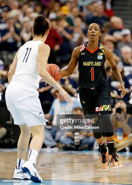 Laurin Mincy of the Maryland Terrapins drives against Kia Nurse of the Connecticut Huskies in the second half during the NCAA Women's Final Four...