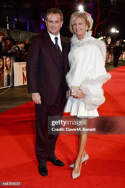 Hugh Bonneville and Lulu Williams attend the UK Premiere of "The Monuments Men" at Odeon Leicester Square on February 11, 2014 in London, England.