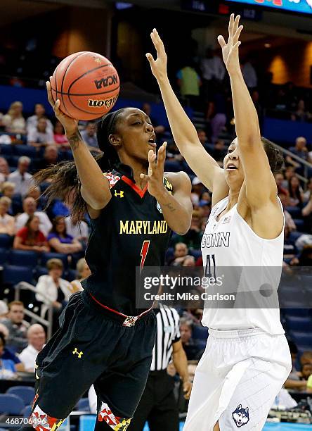 Laurin Mincy of the Maryland Terrapins passes against Kiah Stokes of the Connecticut Huskies in the second half during the NCAA Women's Final Four...