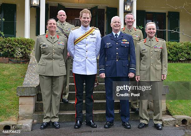 Prince Harry stands with Brigadier Dianne Gallasch, Commandant RMC, Warrant Officer David Ashley RSM-A, Australian Defence Force chief Air Chief...