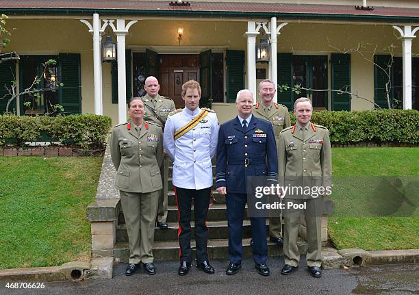 Prince Harry stands with Brigadier Dianne Gallasch, Commandant RMC, Warrant Officer David Ashley RSM-A, Australian Defence Force chief Air Chief...