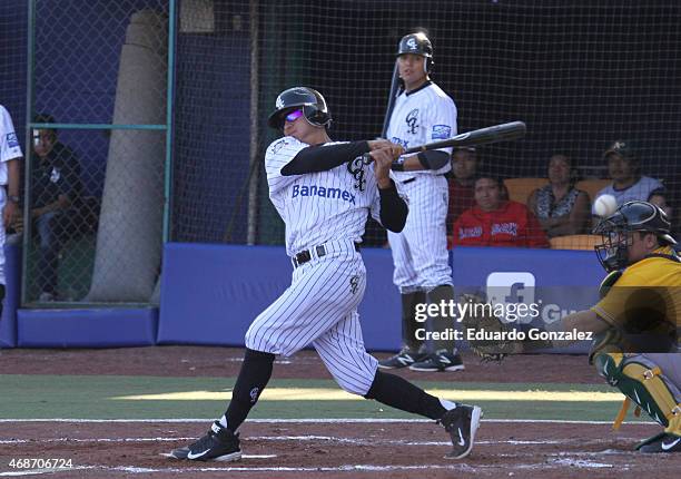 Jaime Brena of Guerreros bats the ball during an opening season match between Pericos de Puebla and Guerreros de Oaxaca as part of Mexican Baseball...