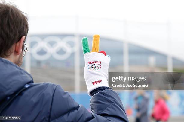 Fan wears Olympic gloves in the Olympic Park on Day 4 of the 2014 Winter Olympics on February 11, 2014 in Sochi, Russia.