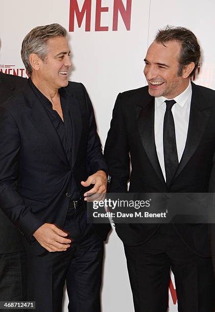 George Clooney and Jean Dujardin attend the UK Premiere of "The Monuments Men" at Odeon Leicester Square on February 11, 2014 in London, England.