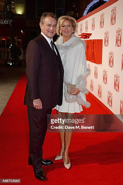 Hugh Bonneville and Lulu Williams attend the UK Premiere of "The Monuments Men" at Odeon Leicester Square on February 11, 2014 in London, England.