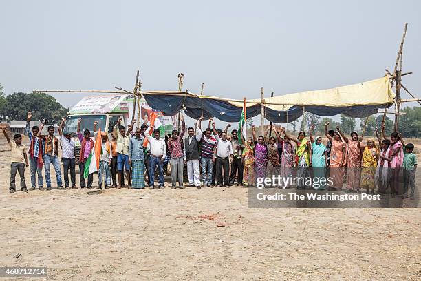 Unidentified villagers pose for a portrait at their protest camp close to the resettlement and rehabilitation colony construction site of the Indian...