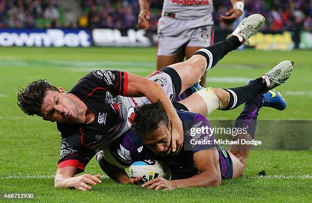 Will Chambers of the Storm scores a try against Chad Townsend of the Warriors during the round five NRL match between the Melbourne Storm and the New...