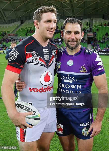 Ryan Hoffman of the Warriors and Cameron Smith of the Storm hug after the round five NRL match between the Melbourne Storm and the New Zealand...