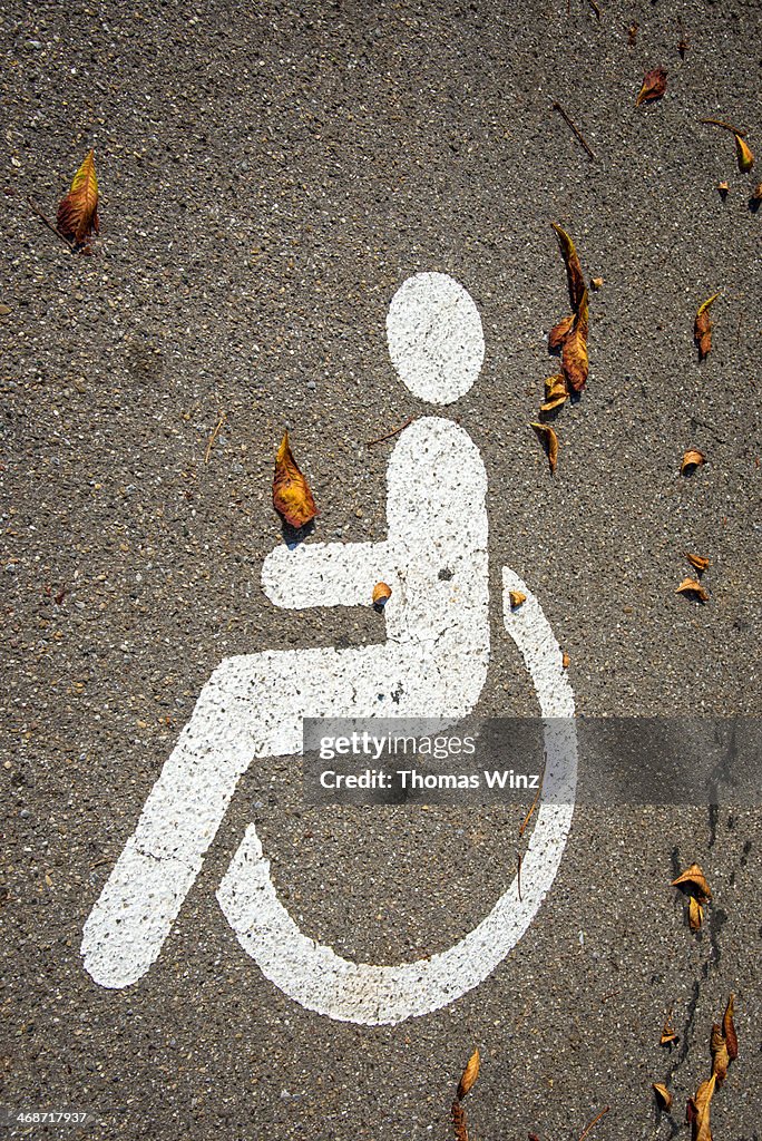 Wheelchair symbol on parking space