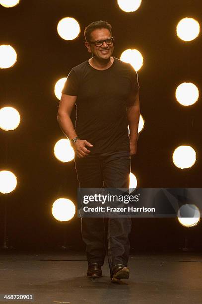 Designer Naeem Khan walks the runway at the Naeem Khan fashion show during Mercedes-Benz Fashion Week Fall 2014 at The Theatre at Lincoln Center on...