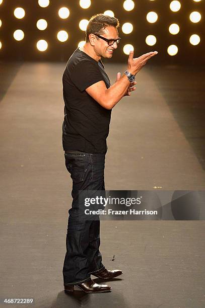 Designer Naeem Khan walks the runway at the Naeem Khan fashion show during Mercedes-Benz Fashion Week Fall 2014 at The Theatre at Lincoln Center on...