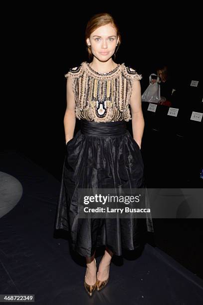 Holland Roden attends the Naeem Khan fashion show during Mercedes-Benz Fashion Week Fall 2014 at The Theatre at Lincoln Center on February 11, 2014...