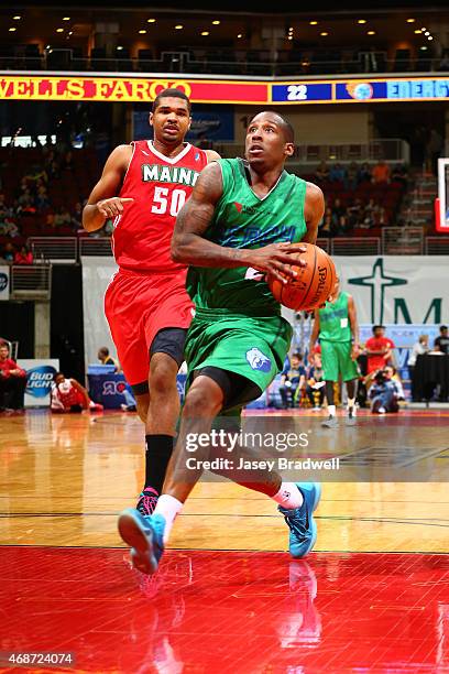 Marcus Hall of the Iowa Energy drives to the basket past Ralph Sampson of the Maine Red Claws in an NBA D-League game on April 4, 2015 at the Wells...