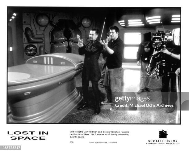 Actor Gary Oldman and director Stephen Hopkins on set of the New Line Cinema movie " Lost in Space " , circa 1998.