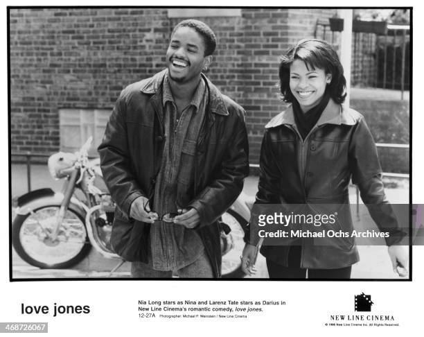 Actor Larenz Tate and actress Nia Long on set of the New Line Cinema movie " Love Jones" , circa 1997.