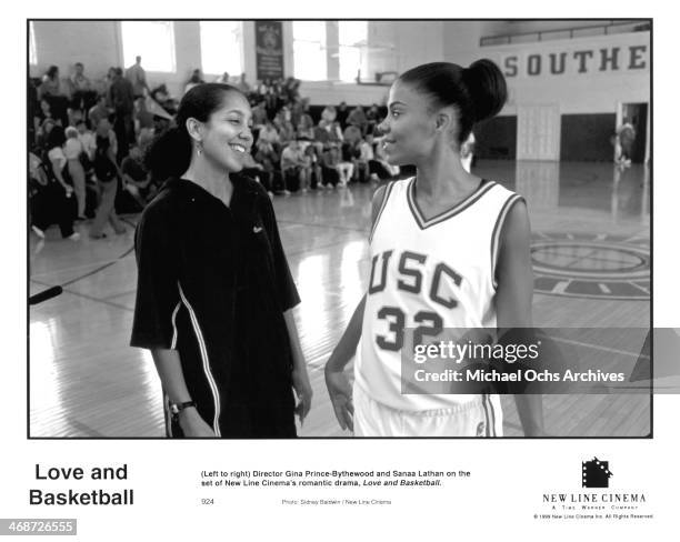 Director Gina Prince-Bythewood and actress Sanaa Lathan on set of the New Line Cinema movie " Love & Basketball " , circa 2000.