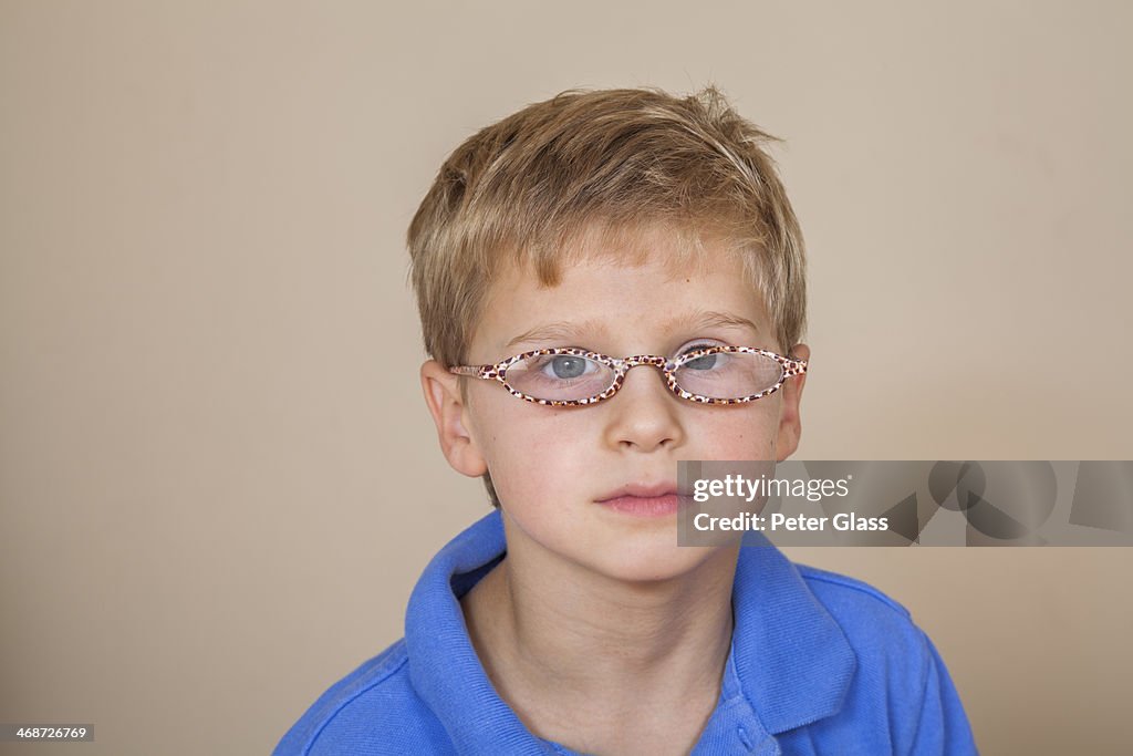 Young boy wearing glasses