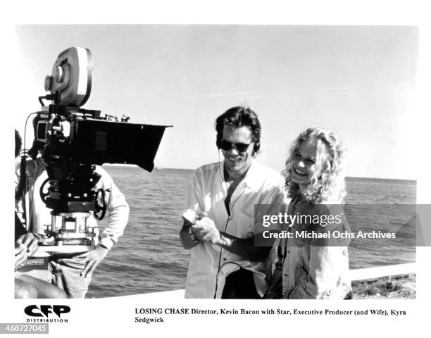 Director Kevin Bacon with star, executive producer, wife, actress Kyra Sedgwick on set of the movie "Losing Chase" circa 1996.