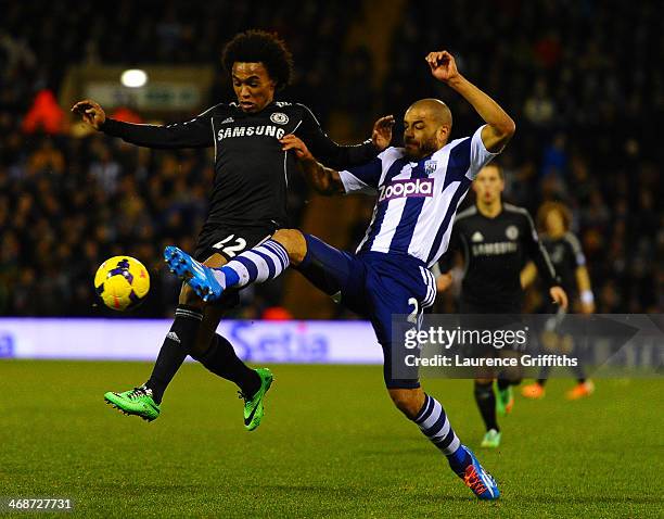 Willian of Chelsea is tackled Steven Reid of West Brom during the Barclays Premier League match between West Bromwich Albion and Chelsea at The...