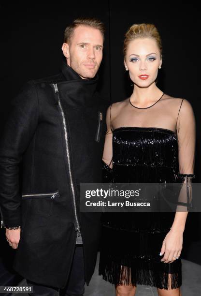 Oliver Trevenna and Laura Vandervoort attend the Naeem Khan fashion show during Mercedes-Benz Fashion Week Fall 2014 at The Theatre at Lincoln Center...