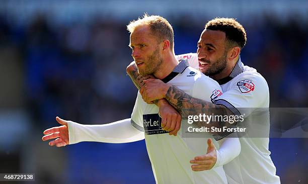 Bolton players Eidur Gudjohnsen and Craig Davies celebrate the first Bolton goal during the Sky Bet Championship match between Cardiff City and...