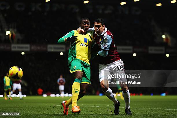 Sébastien Bassong of Norwich City and Marco Borriello of West Ham United challenge for the ball during the Barclays Premier League match between West...