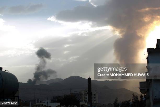 Smoke and flames rise allegedly from Shiite Huthi rebels camps located on Fajj Attan Hill and Aser mountain following an airstrike by the Saudi-led...