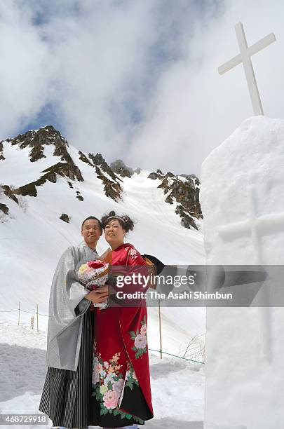 Newly wed couple attends the 'Pure White Wedding' hosted by Komagane City at Senjojiki Kar on April 4, 2015 in Komagane, Nagano, Japan. The snow...
